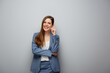 © Yuriy Shevtsov - Smiling business woman in suit pointing finger up. Isolated female portrait.