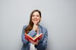 © Yuriy Shevtsov - Thinking woman teacher or smiling student girl portrait with open red book..