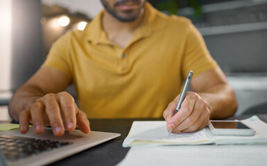 Poster - Businessman, hands and writing with pen by laptop for accounting, finance or planning schedule at home. Hand of male, person or remote employee busy with paperwork, diary or book for financial plan