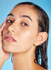 Canvas Print - Portrait, water and woman cleaning, skincare and dermatology for health, wellness and on blue studio background. Face, lady and female with hygiene, wet and shower for natural beauty and cosmetics