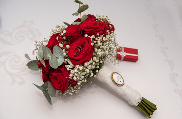 Wall Mural - small red box and the bride's bouquet at a wedding in Romania