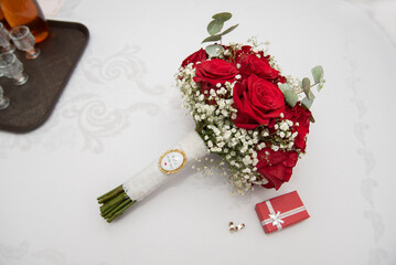 Wall Mural - small red box and the bride's bouquet at a wedding in Romania