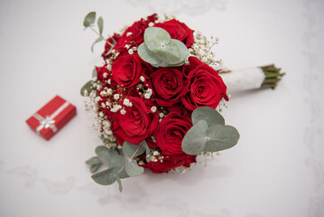 Wall Mural - small red box and the bride's bouquet at a wedding in Romania