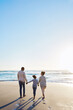 © Reese/peopleimages.com - Family, beach and walk during sunset on vacation or holiday relaxing and enjoying peaceful scenery at the ocean. Sea, water and parents with daughter, child or kid with childhood freedom