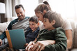 © Reese/peopleimages.com - Relax, children and parents reading a book for bonding, fun and quality time. Knowledge, information and boys excited about learning a story together on the lounge sofa with their mother and father
