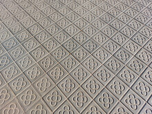 Pavement In Barcelona Made Of Small Tiles With The Traditional Pattern "flower Of Barcelona" (la Flor De Barcelona)