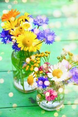 Wall Mural - Beautiful bouquet of wildflowers with magic bokeh light -  greeting card 