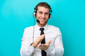 Sticker - Telemarketer caucasian man working with a headset isolated on blue background applauding after presentation in a conference