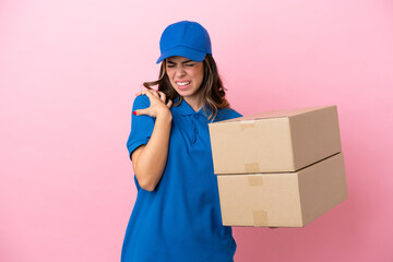 Wall Mural - Delivery Italian woman isolated on pink background suffering from pain in shoulder for having made an effort