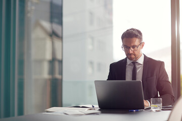 Laptop, office and business man reading email, working on website and corporate planning. Schedule, software app and data analytics of a professional worker, ceo or executive on digital technology