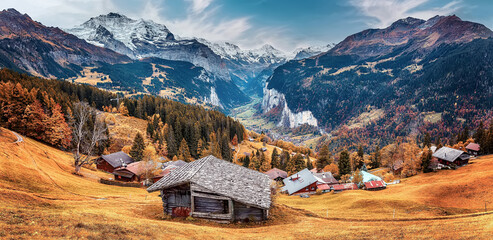 Fototapete - Incredible autumn view of beautiful alpine Wengen village and Lauterbrunnen Valley during sunset. Amazing nature Switzerland scenery with colorful sky. Wonderful Autumn landscape of Swiss alps