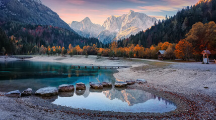 Aufkleber - Fantastic nature scenery during sunset. Vivid autumn landscape with in the Alps with beautiful calm highland lake and mountain tops in the background. Concept of an ideal resting place. Creative image