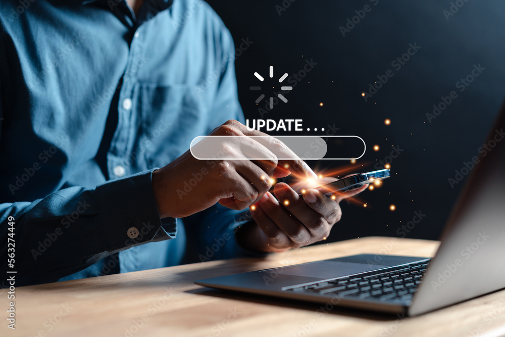 Update software system in computer. Man using smartphone upgrade program, Business technology internet loading virtual bar with installing the update for the quality better.
