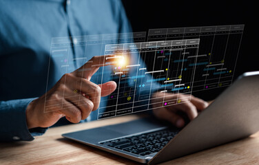 Analyst working with computer in Business Analytics and Data Management System to make report with KPI and metrics connected to database. Corporate strategy for finance, operations, sales, marketing.