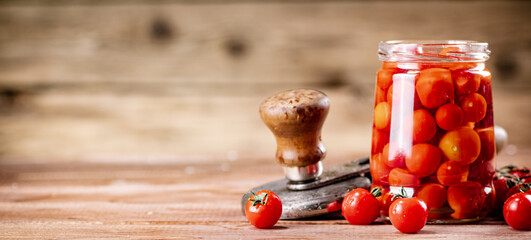 Poster - Pickled ripe tomatoes in a glass jar. 