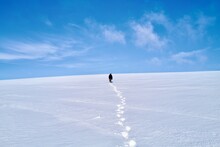 Person Leaving Behind A Track In The  Snow 
