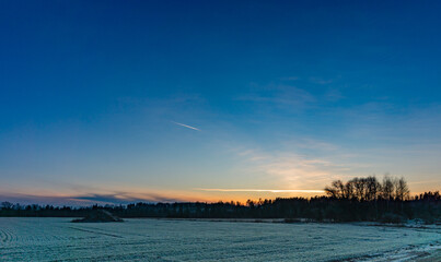 Wall Mural - sunset sky. airplane line. sunset line. forest line. nature background