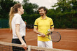 © prostooleh - Two tennis players talking on a tennis court before the match