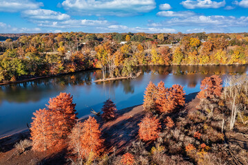 Beautiful colorful autumn day on the Elk River with an island and Estill Springs City Park in the background. Tims Ford lake in Tennessee USA.