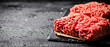 Raw minced meat on a stone board. 