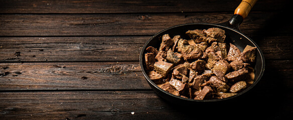 Canvas Print - Liver fried in a frying pan. 