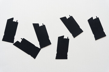 Poster - set of black paper shapes (tile like) on white