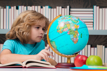 Fototapete - Back to school. Funny little child from elementary school with book. Education. Kid study and learning.