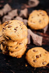 Poster - Cookies with pieces of milk chocolate on the table. 