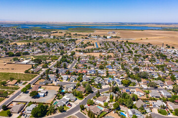 Wall Mural - Drone photos over a community in Northern California. With houses, trees and a blue sky