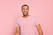 © New Africa - Portrait of happy African American man on pink background