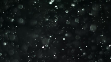 Wall Mural - Abstract background with animation of flying and flickering particles as bokeh of light. Animation of seamless loop.Dust bubbles snow animation.Bokeh Shiny Particles Loop Animation.