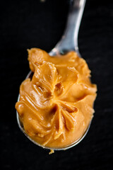 Poster - A spoonful full of peanut butter. 