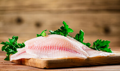 Sticker - Fresh fish fillet on a cutting board. 