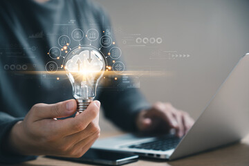 Wall Mural - hand holding light bulb, cloud computer technology and storage online for computer business network 