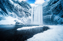 Majestic Nature Of Winter Iceland. Impressively View On Skogafoss Waterfal. Skogafoss The Most Famous Place Of Iceland