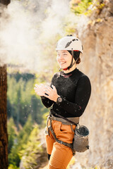 Wall Mural - Climber wearing in climbing equipment. Practicing rock-climbing on a rock  mountain wall. Climbing sports and bouldering concept. rock climber climbs on a rocky wall.