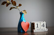 © alexkich - Wooden calendar show of February 14 with red heart