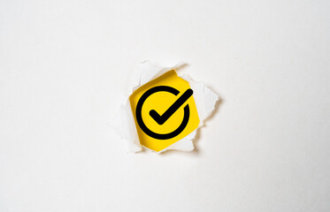 Fototapete - correct sign symbol inside of white paper punched for document and project check approve concept, Quality assurance and ISO guarantee concept.