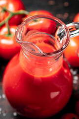 Poster - A full jug of tomato juice. 