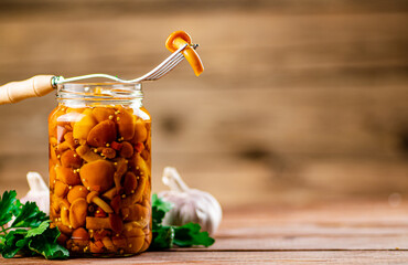 Canvas Print - Glass jar with marinated mushrooms.