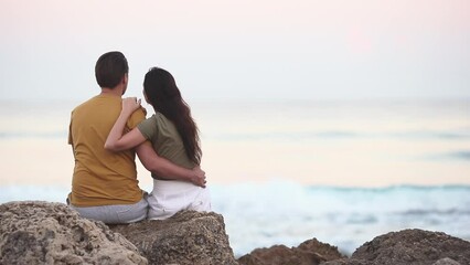 Wall Mural - Young couple spending time together on the beach