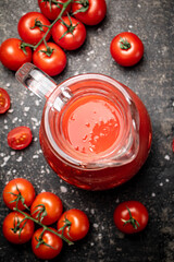 Poster - Jug with tomato juice on the table. 