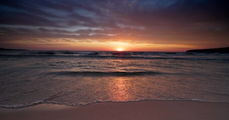 Canvas Print - Relaxing sunrise on the beach shore. Sunset over the ocean and seascape, 4K inspirational video