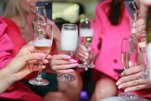 Glasses Of Champagne On A Party, Girls In Pink Celebrate Their Birthday In A Limo Pouring Champagne Into Glasses