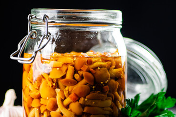 Canvas Print - Fragrant pickled mushrooms in a glass jar. 