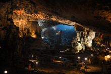 Large Foggy Illuminated Underground Cave In Limestone Rock In Vietnam