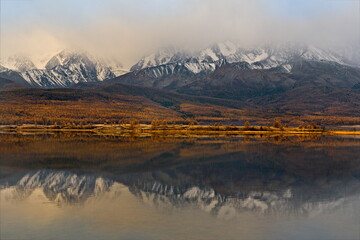 Wall Mural - Russia. The South of Western Siberia, the Altai Mountains. View of Lake Dzhangyskol, lost in the Kurai steppe, with swampy marshy shores at the foot of the North Chui mountain range.