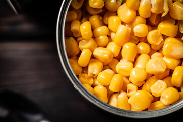 Poster - An open can of canned corn. 