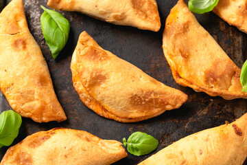 Wall Mural - Freshly baked mini calzones filled with bolognese