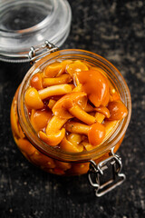 Canvas Print - Marinated mushrooms in an open glass jar. 